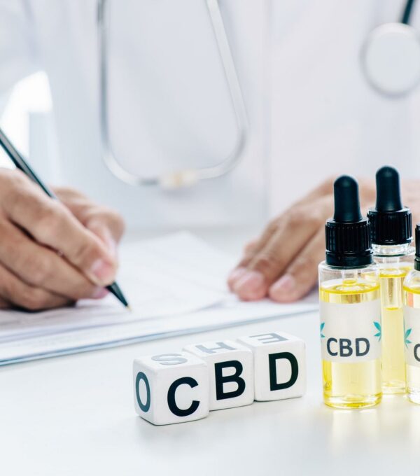 selective focus of cubes and cannabis oil with lettering CBD